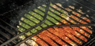 Contramar fish grilled with red and green salsa on a charcoal grill